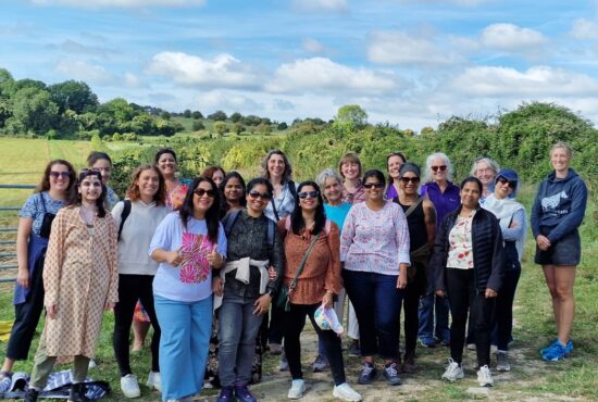 Group of ethnically diverse people gather in nature