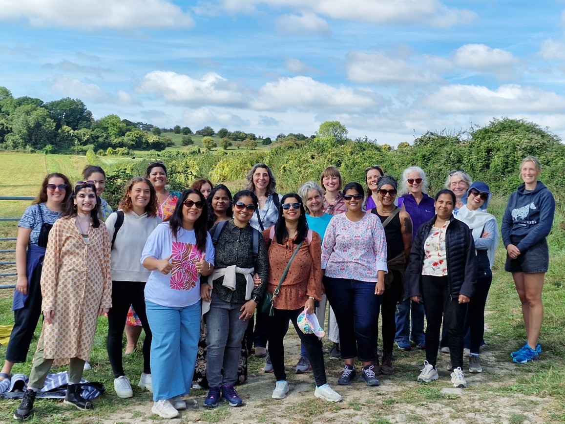 Group of ethnically diverse people gather in nature