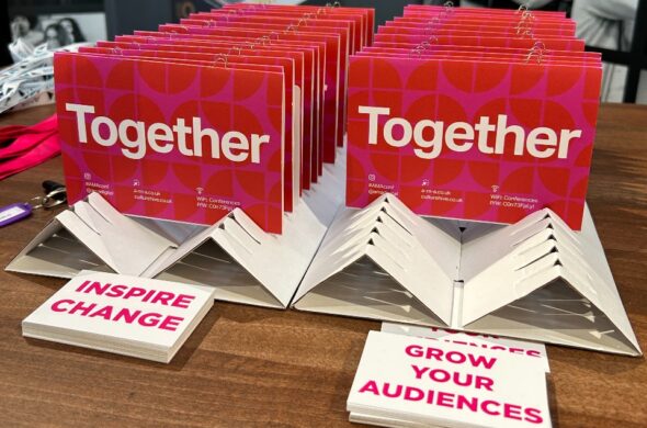 Rows of cards that say 'Together' and in the foreground one card that says 'Inspire change' and another that says 'Grow your audiences'