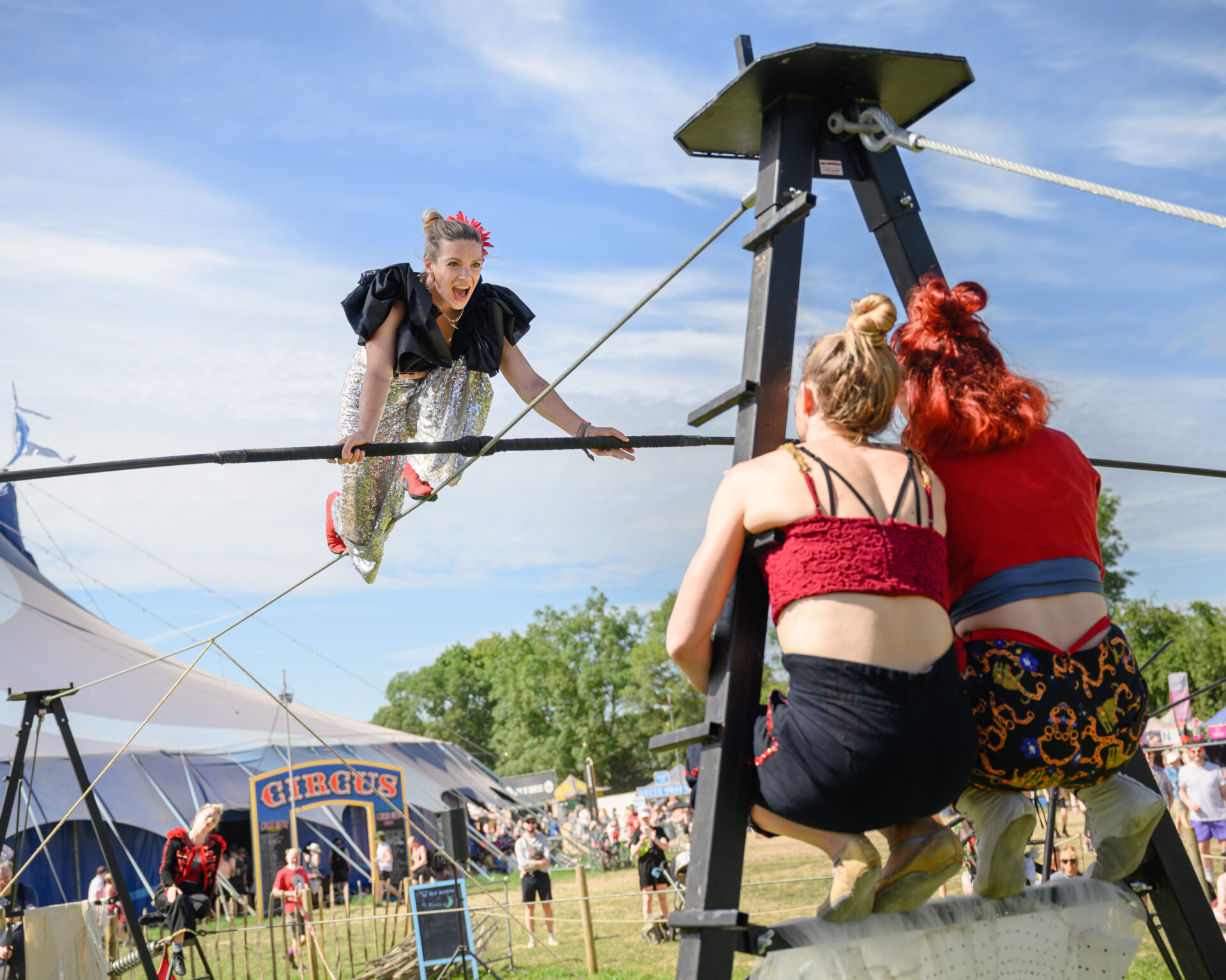 Woman kneeling on a high wire